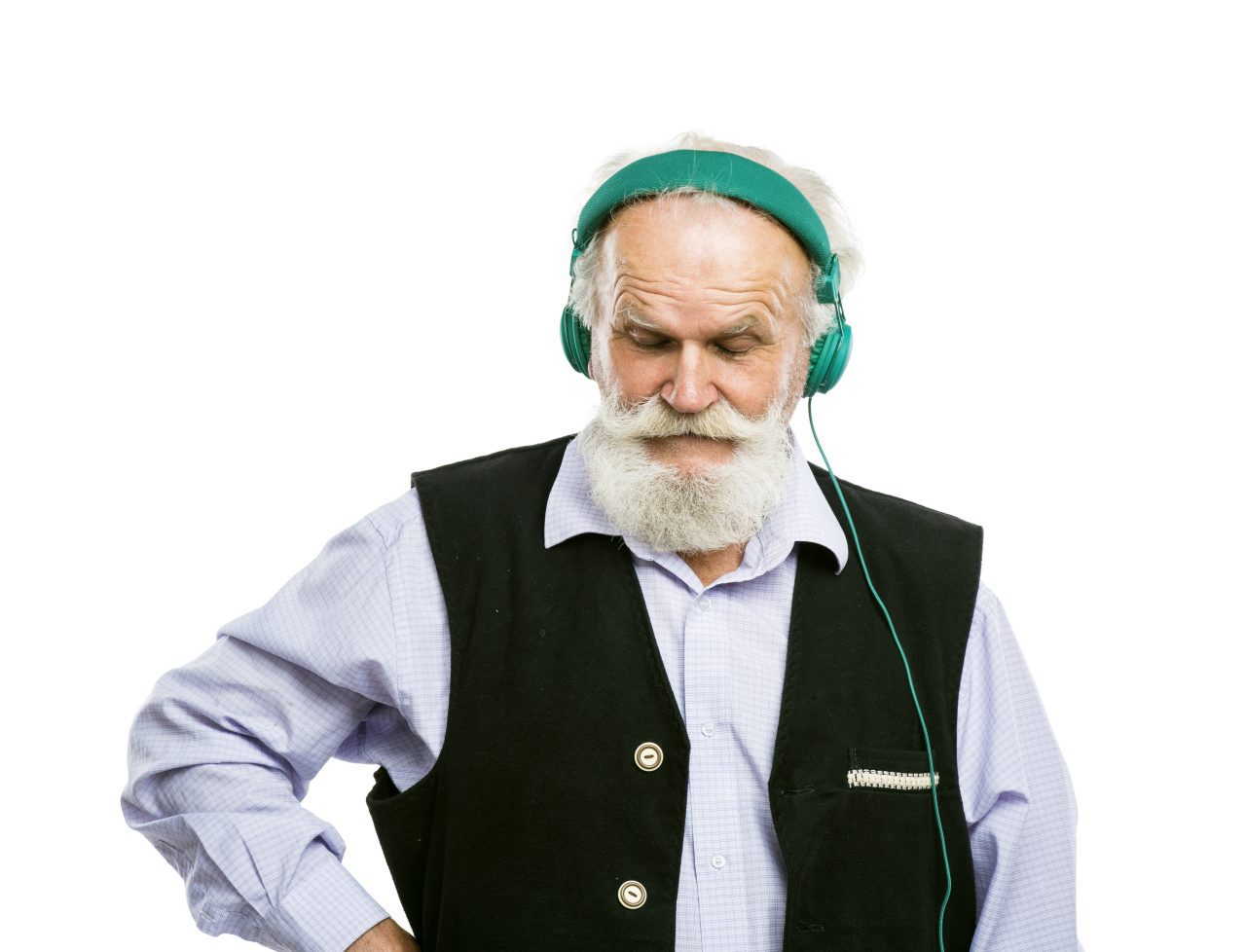 Old active bearded man with headphones listening to music isolated on white background